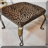 F09. Small metal footstool with leopard print upholstery. 9.5” h x 12”w x 12”d 